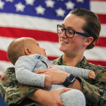 Marine holds baby